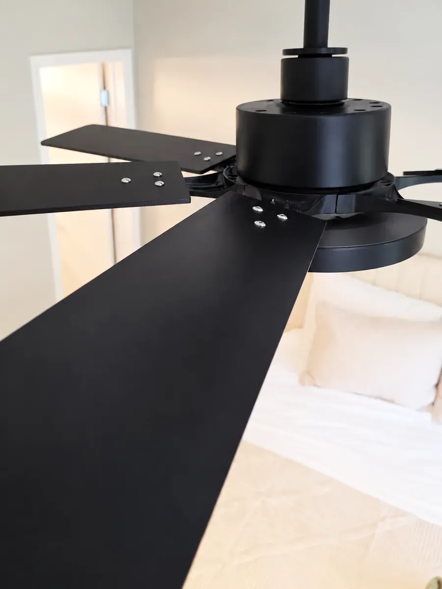 The same ceiling fan blades, wiped clean by Brio Cleaning