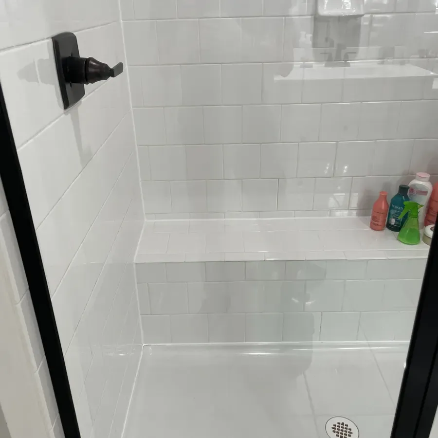 a tiled walk-in shower, after cleaning by Brio Cleaning