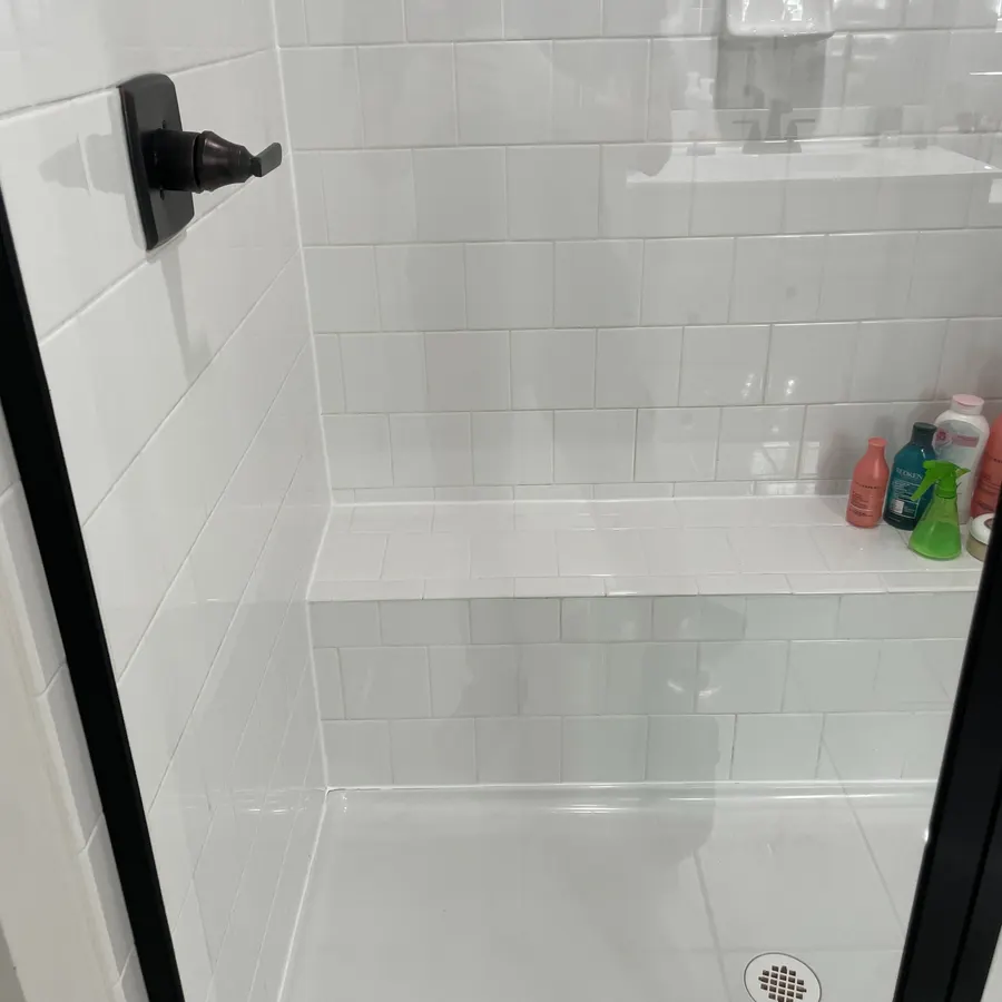 a tiled walk-in shower, after cleaning by Brio Cleaning